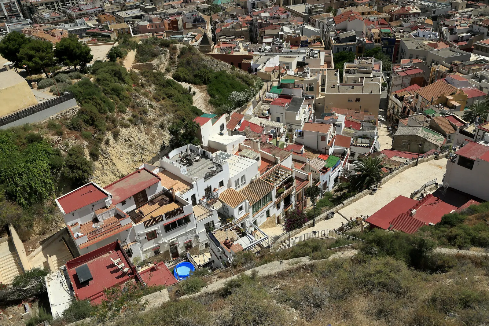 The rooftops and steps of the Santa Cruz quarter seen from above on the slope of Mount Benacantil; a general photograph of the quarter